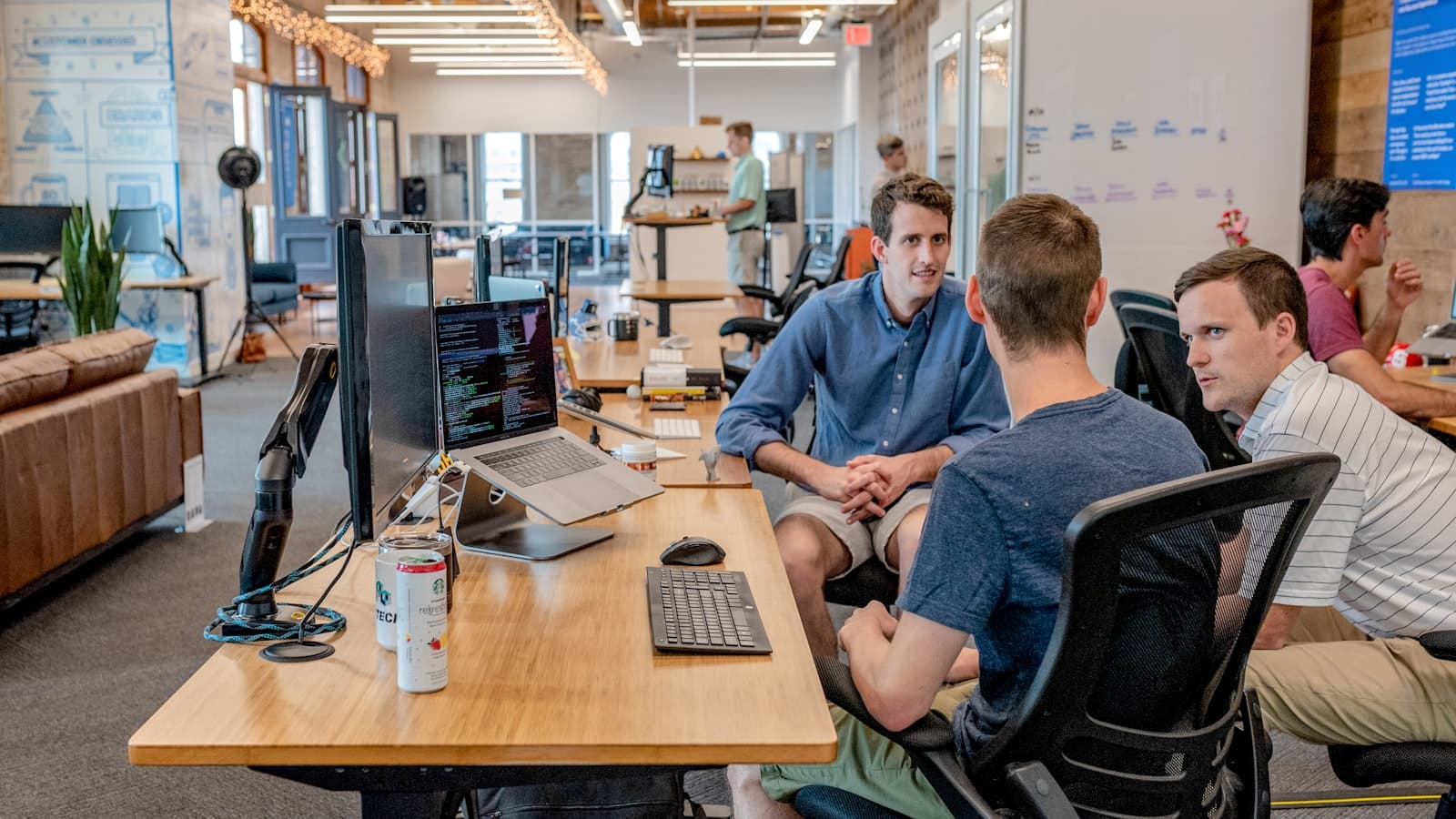 Business team discussing growth plans in a modern meeting space